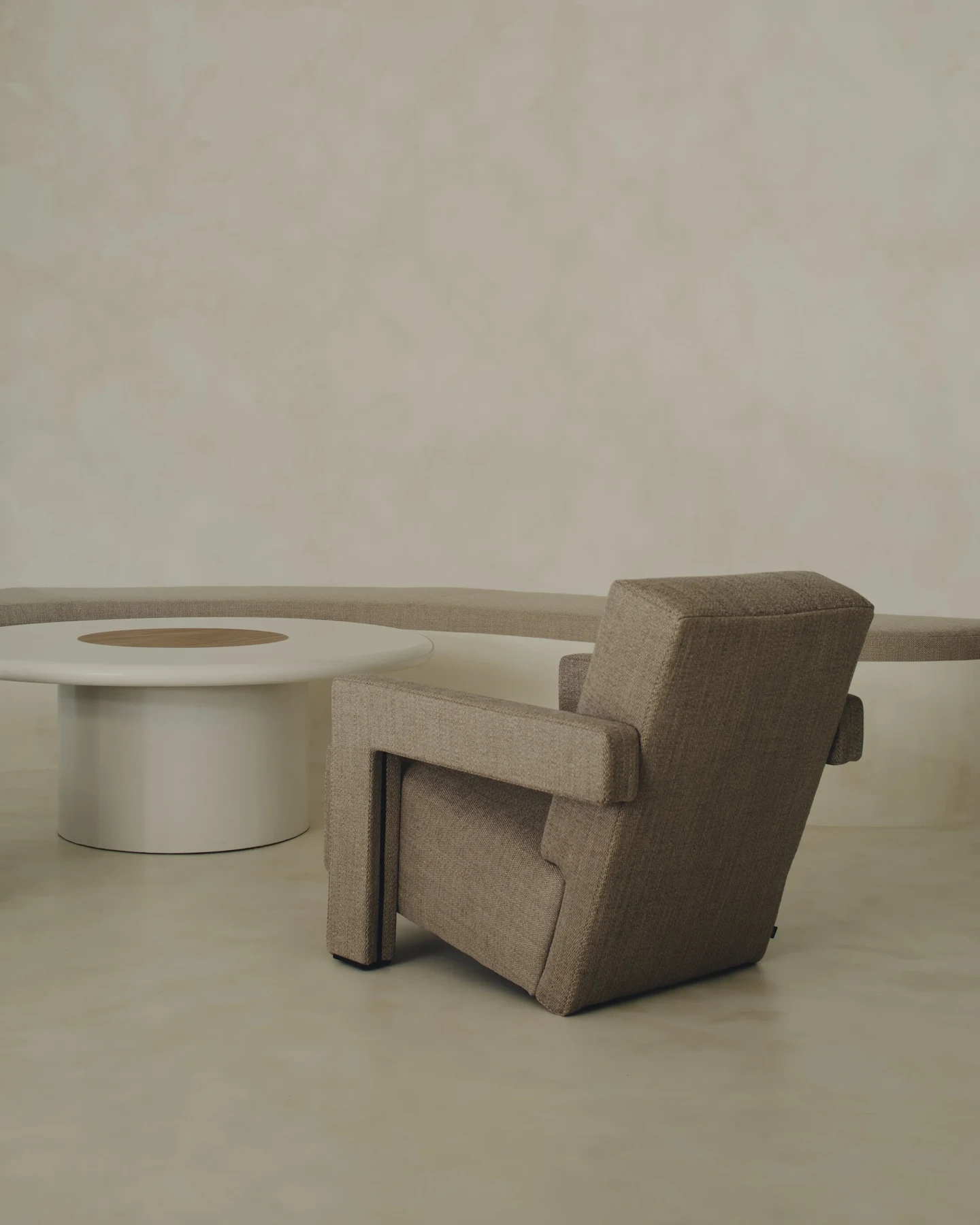 Warm-toned handcrafted surfaces and sculptural furniture in the TSURI showroom